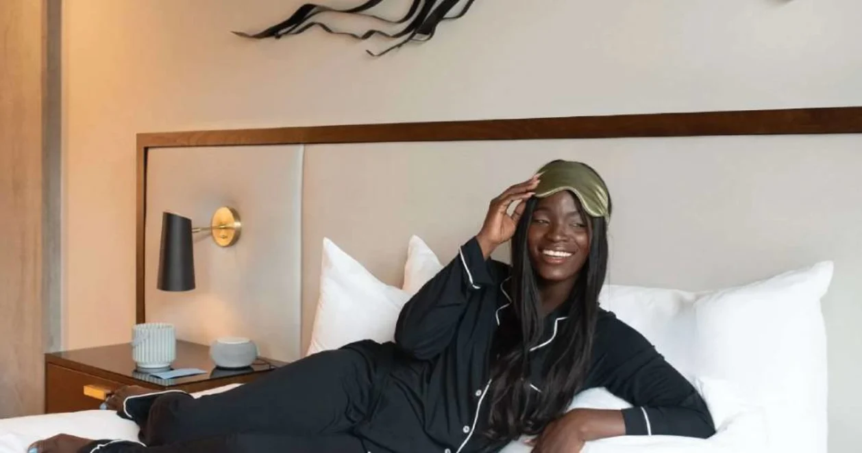 Guest on bed at Mountain Shadows Resort